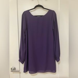 A Lulus purple shift dress with long sleeves, buttoned cuffs and scoop neck line